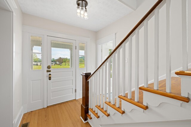 630 Battlefield Rd, Fort Defiance, VA 24437 - entryway with stairs, light wood-style floors, and baseboards