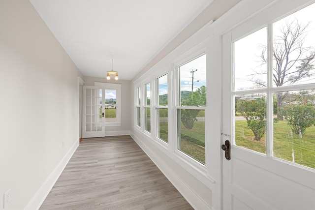 630 Battlefield Rd, Fort Defiance, VA 24437 - unfurnished sunroom with baseboards, wood finished floors, and lofted ceiling