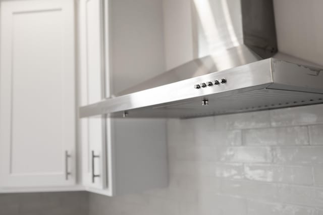 630 Battlefield Rd, Fort Defiance, VA 24437 - kitchen view of wall chimney exhaust hood and white cabinets