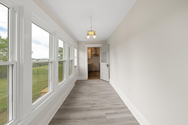 630 Battlefield Rd, Fort Defiance, VA 24437 - hall with a chandelier, baseboards, and light wood finished floors