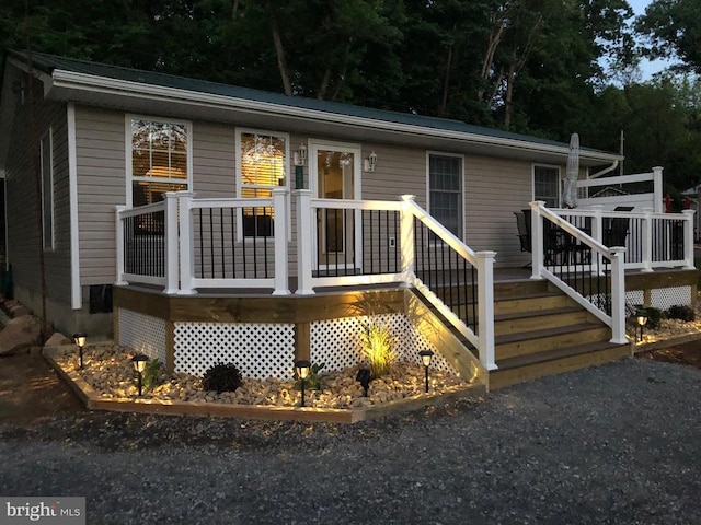 view of front of home with a wooden deck