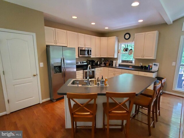 6029 Lost Cove Dr, Mineral, VA 23117 - kitchen with appliances with stainless steel finishes, baseboards, healthy amount of natural light, wood finished floors, and recessed lighting