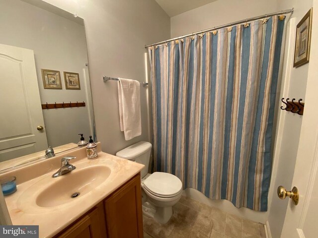 6029 Lost Cove Dr, Mineral, VA 23117 - bathroom with toilet, vanity, a shower with curtain, and tile patterned flooring