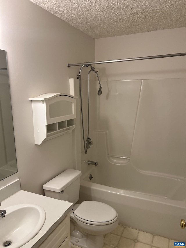 7 Englewood Dr, Palmyra, VA 22963 - bathroom with a textured ceiling, vanity, tile patterned flooring, and washtub / shower combination