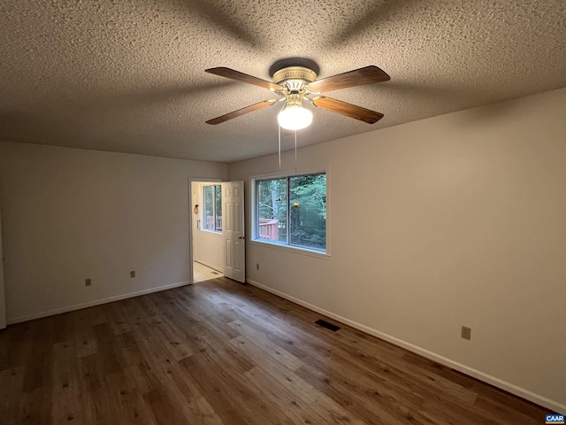 7 Englewood Dr, Palmyra, VA 22963 - spare room featuring wood finished floors, ceiling fan, and a textured ceiling