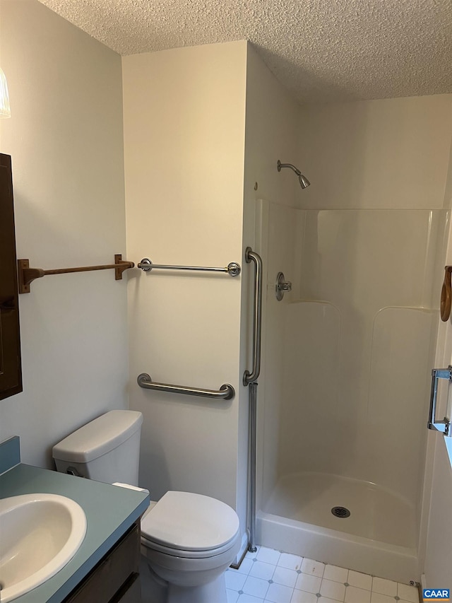 7 Englewood Dr, Palmyra, VA 22963 - full bath with vanity, a textured ceiling, walk in shower, and tile patterned floors