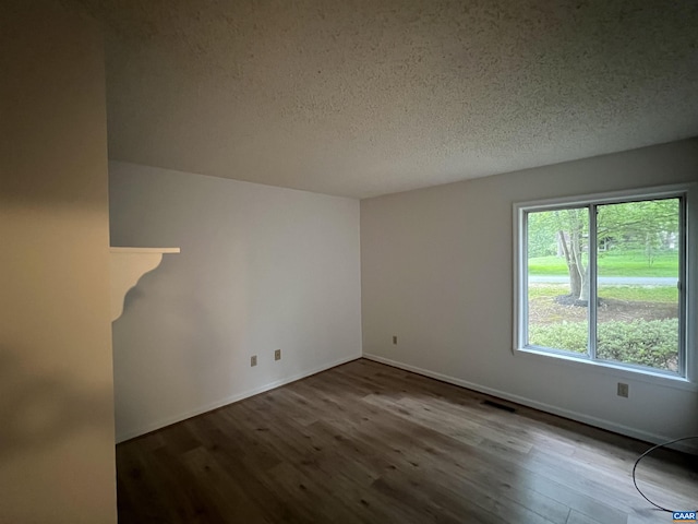 7 Englewood Dr, Palmyra, VA 22963 - empty room featuring wood finished floors and a textured ceiling