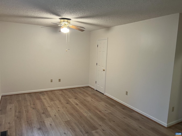 7 Englewood Dr, Palmyra, VA 22963 - spare room with a ceiling fan, wood finished floors, and a textured ceiling