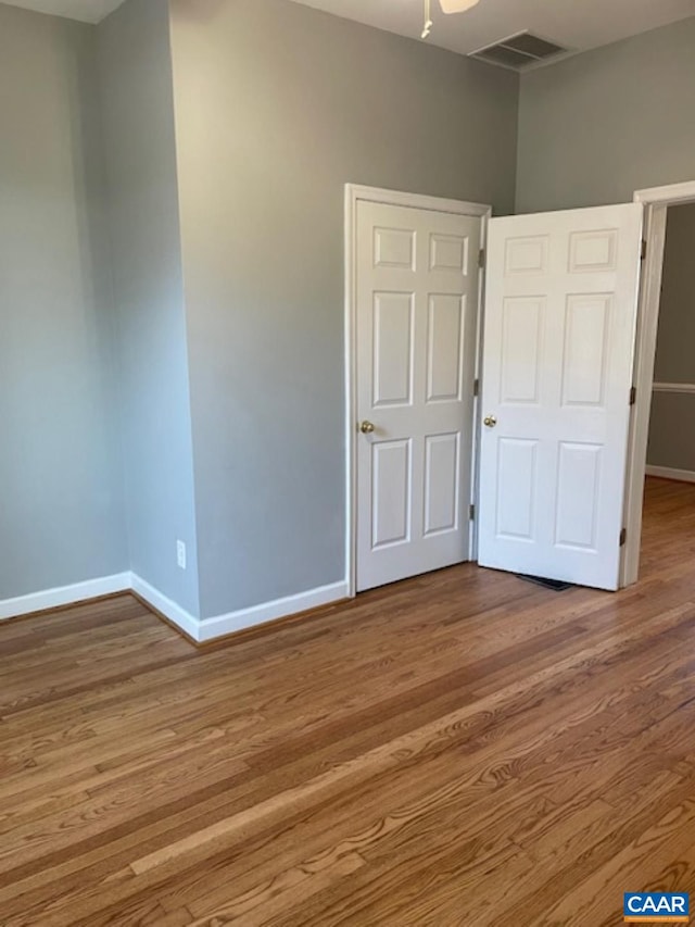 1414 Midland St, Charlottesville, VA 22902 - unfurnished bedroom featuring baseboards and wood finished floors