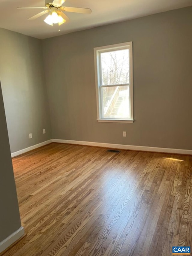 1414 Midland St, Charlottesville, VA 22902 - empty room featuring a ceiling fan, wood finished floors, and baseboards