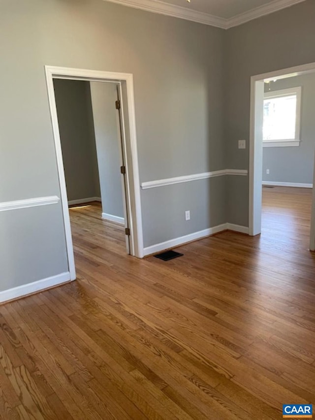 1414 Midland St, Charlottesville, VA 22902 - spare room with ornamental molding, baseboards, and wood finished floors