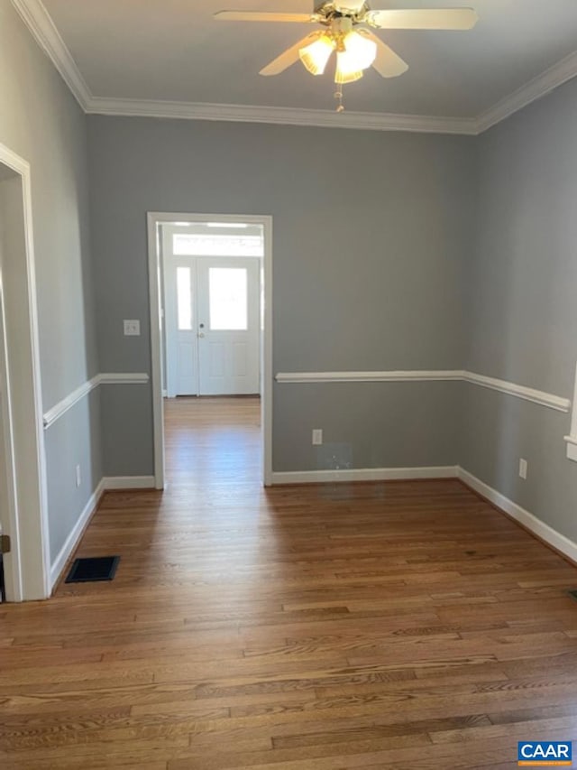 1414 Midland St, Charlottesville, VA 22902 - empty room featuring ceiling fan, wood finished floors, crown molding, and baseboards