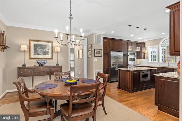 10042 Cedar Spring Ln, Culpeper, VA 22701 - dining room featuring light wood-style floors, ornamental molding, recessed lighting, and a chandelier