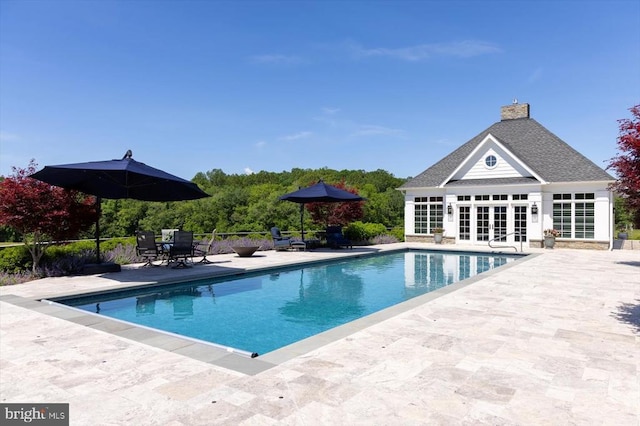 10042 Cedar Spring Ln, Culpeper, VA 22701 - outdoor pool with a patio area, a storage structure, an outbuilding, and french doors