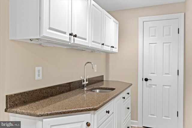 10042 Cedar Spring Ln, Culpeper, VA 22701 - kitchen with white cabinetry and dark stone counters