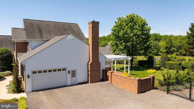 10042 Cedar Spring Ln, Culpeper, VA 22701 - view of property exterior featuring gravel driveway, a chimney, an attached garage, and roof with shingles