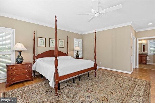 10042 Cedar Spring Ln, Culpeper, VA 22701 - bedroom with wood finished floors, crown molding, ceiling fan, and connected bathroom