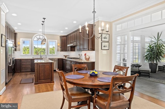 10042 Cedar Spring Ln, Culpeper, VA 22701 - dining room with light wood-type flooring, crown molding, recessed lighting, and a chandelier