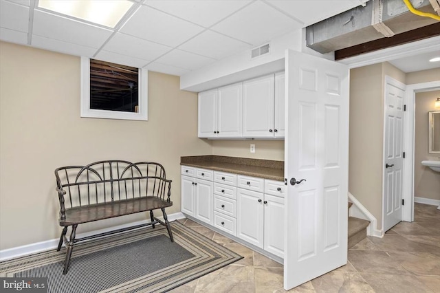 10042 Cedar Spring Ln, Culpeper, VA 22701 - living area featuring a paneled ceiling and stairway