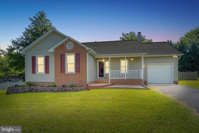 11505 Brian Dr, Fredericksburg, VA 22407 - view of front of property with covered porch, gravel driveway, an attached garage, and a front lawn