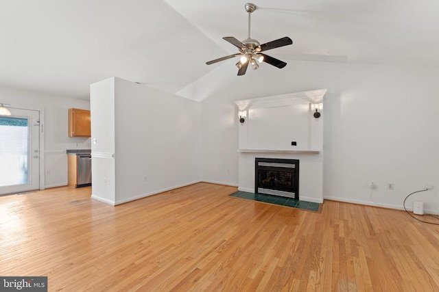 11505 Brian Dr, Fredericksburg, VA 22407 - unfurnished living room featuring light wood finished floors, a ceiling fan, a fireplace with flush hearth, and lofted ceiling