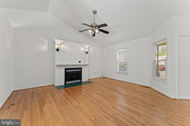 11505 Brian Dr, Fredericksburg, VA 22407 - unfurnished living room with light wood-style flooring, vaulted ceiling, ceiling fan, and a fireplace with flush hearth