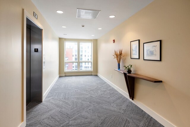 200 Garrett St Unit 609, Charlottesville, VA 22902 - hallway with elevator, carpet floors, baseboards, and recessed lighting