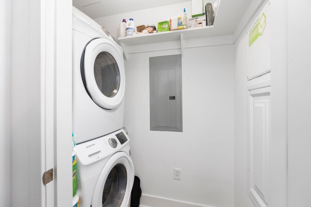 200 Garrett St Unit 609, Charlottesville, VA 22902 - laundry area featuring stacked washing machine and dryer and electric panel