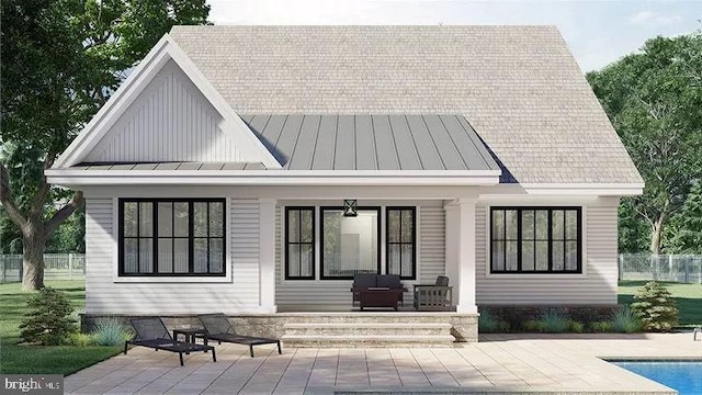 51 Lighthouse Dr, Bumpass, VA 23024 - back of house featuring a standing seam roof, an outdoor pool, metal roof, and covered porch