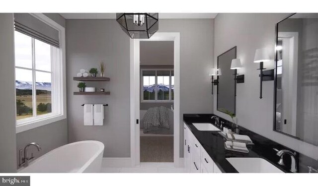 51 Lighthouse Dr, Bumpass, VA 23024 - bathroom with a freestanding tub, double vanity, baseboards, a chandelier, and ensuite bathroom