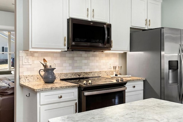 kitchen featuring white cabinetry, tasteful backsplash, stainless steel refrigerator with ice dispenser, and range with electric cooktop