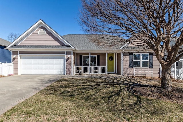 ranch-style home featuring a front yard, fence, covered porch, concrete driveway, and a garage