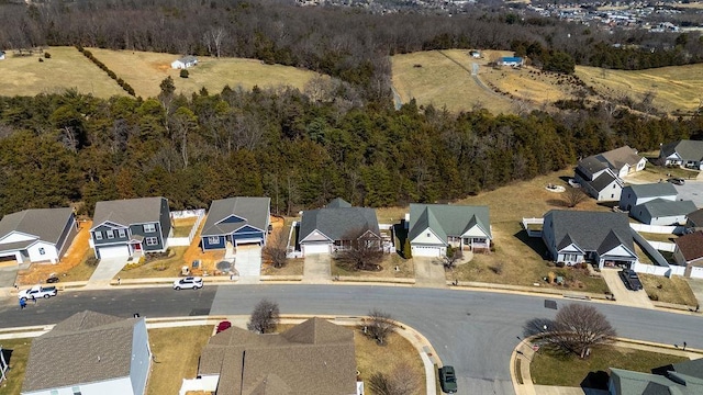 aerial view featuring a residential view and a view of trees