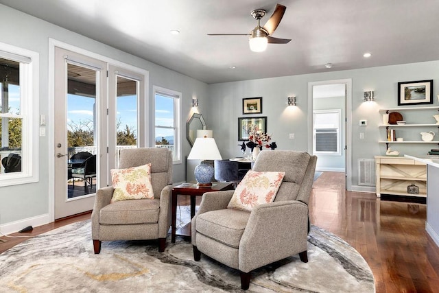 sitting room with visible vents, wood finished floors, recessed lighting, baseboards, and ceiling fan