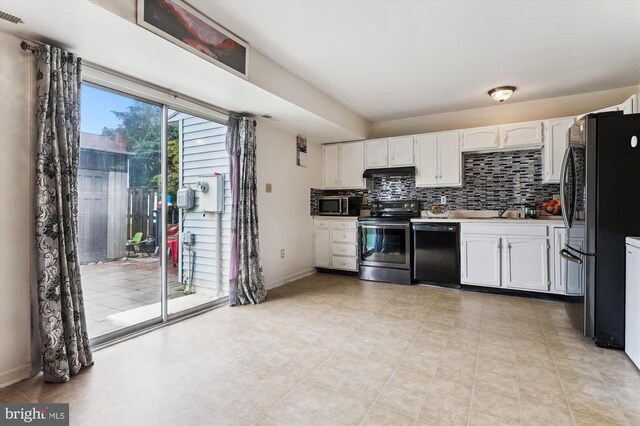 5200 Sweet Gum Ter, Fredericksburg, VA 22407 - kitchen with stainless steel appliances, under cabinet range hood, white cabinetry, and tasteful backsplash