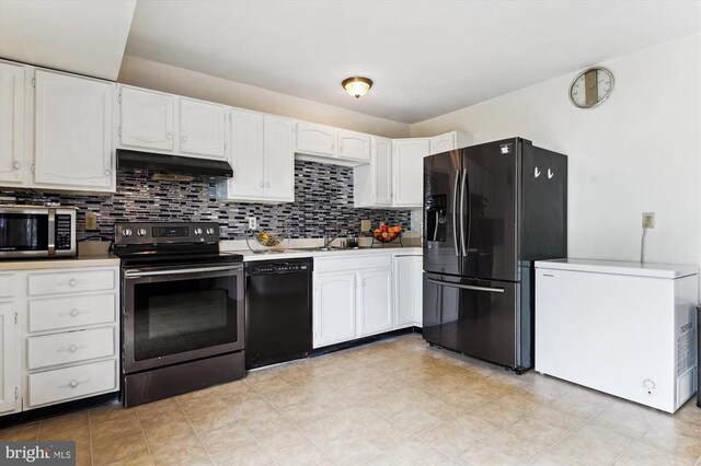5200 Sweet Gum Ter, Fredericksburg, VA 22407 - kitchen with black appliances, under cabinet range hood, white cabinets, and decorative backsplash