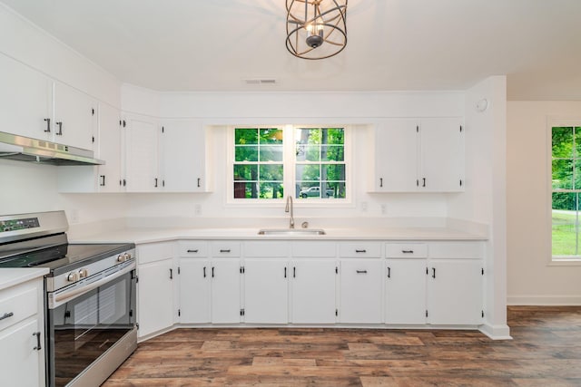 9048 Cinder Run Ln, Elkton, VA 22827 - kitchen with stainless steel range with electric cooktop, under cabinet range hood, white cabinetry, dark wood-type flooring, and light countertops