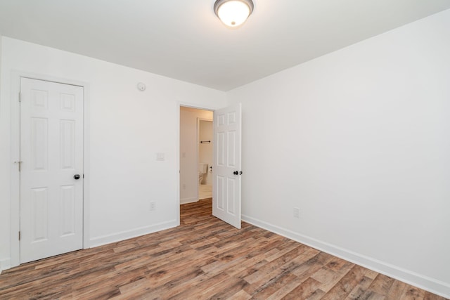 9048 Cinder Run Ln, Elkton, VA 22827 - unfurnished bedroom featuring wood finished floors and baseboards
