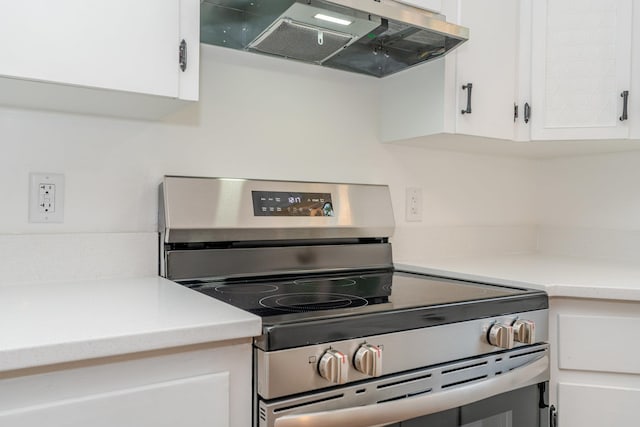 9048 Cinder Run Ln, Elkton, VA 22827 - kitchen featuring stainless steel range with electric stovetop, extractor fan, white cabinetry, and light countertops