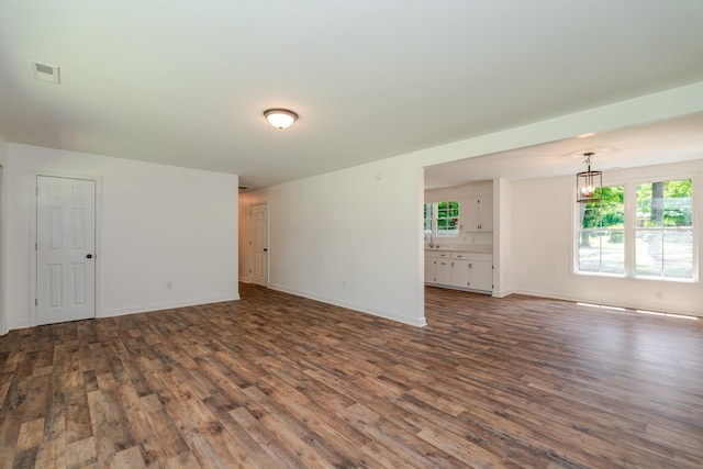 9048 Cinder Run Ln, Elkton, VA 22827 - empty room featuring dark wood finished floors and a chandelier