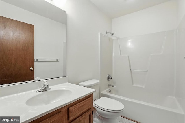 bathroom with toilet, vanity, and shower / bathtub combination