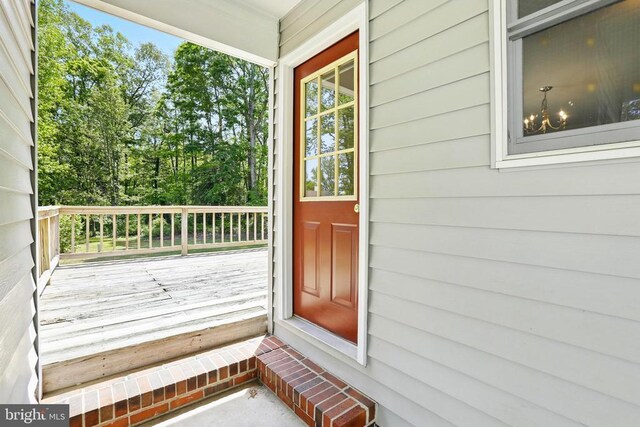 doorway to property featuring a wooden deck