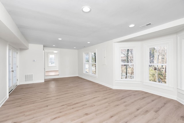 unfurnished living room with light hardwood / wood-style flooring