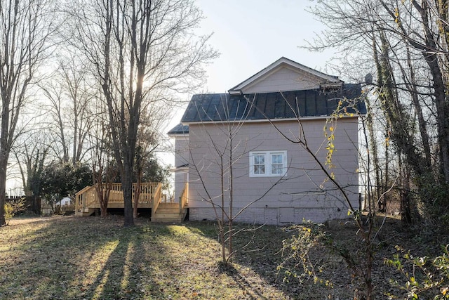 view of side of property featuring a deck