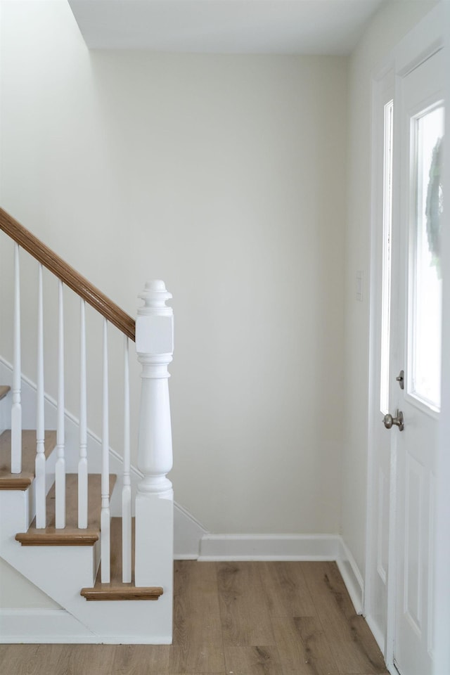 stairway with wood-type flooring