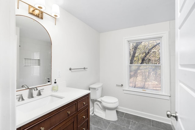 bathroom with tile patterned floors, vanity, and toilet