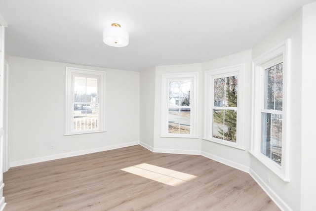 unfurnished room with light hardwood / wood-style flooring