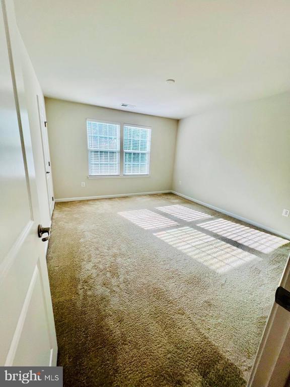 9426 Wood Creek Cir, Fredericksburg, VA 22407 - empty room featuring carpet flooring and baseboards