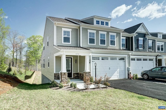 1658 Koch Ct, Charlottesville, VA 22911 - view of property featuring an attached garage, stone siding, aphalt driveway, a front yard, and a porch
