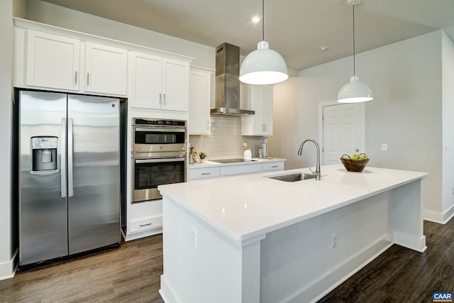 1658 Koch Ct, Charlottesville, VA 22911 - kitchen featuring a sink, wall chimney range hood, dark wood-type flooring, white cabinets, and appliances with stainless steel finishes